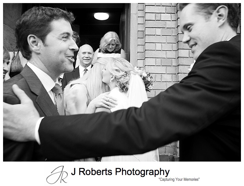 Bride and groom being congratulated after marriage - wedding photography sydney
